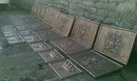 Set of cast bronze plaques.